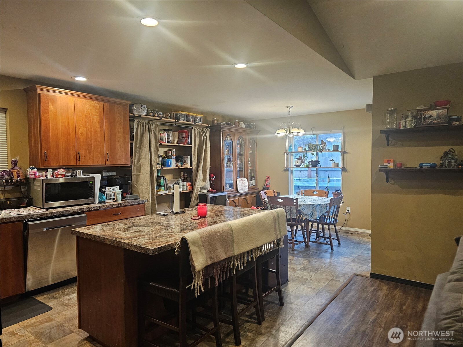 180 A Mossyrock Road West Mossyrock, WA 98564 - Photo 5 of 27 a kitchen with a dining table chairs and refrigerator