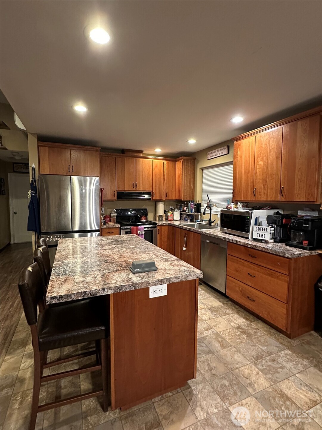 180 A Mossyrock Road West Mossyrock, WA 98564 - Photo 6 of 27 a large kitchen with kitchen island a stove a sink a refrigerator and chairs