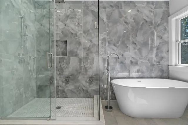 a white bath tub sitting in a bathroom