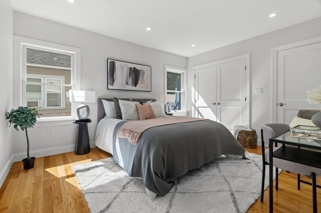 321 Albemarle Road Newton, MA 02460 - Photo 17 of 34 a bedroom with a bed and wooden floor