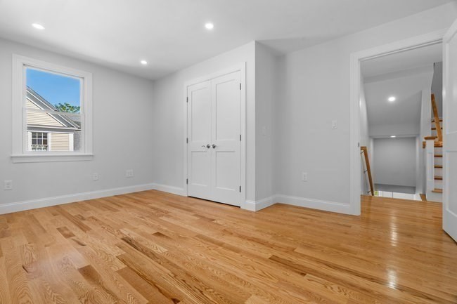 321 Albemarle Road Newton, MA 02460 - Photo 18 of 34 a view of empty room with wooden floor and fan