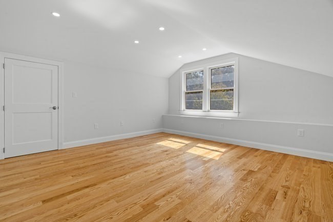 321 Albemarle Road Newton, MA 02460 - Photo 26 of 34 an empty room with wooden floor and windows