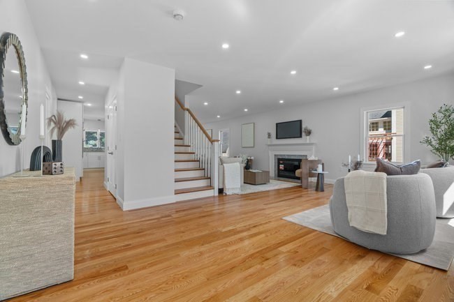 321 Albemarle Road Newton, MA 02460 - Photo 5 of 34 a living room with fireplace furniture and a wooden floor
