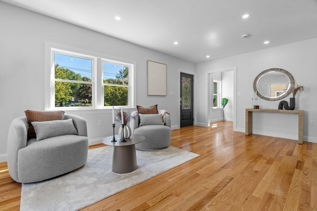 321 Albemarle Road Newton, MA 02460 - Photo 6 of 34 a living room with furniture and a large window