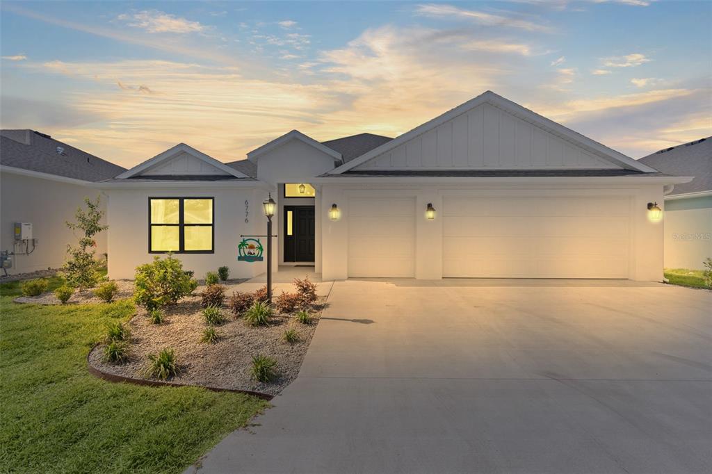 6776 Robinette Run, Unit ROBINETTE RUN The Villages, FL 34762 - Photo 1 of 52 a front view of a house with garden