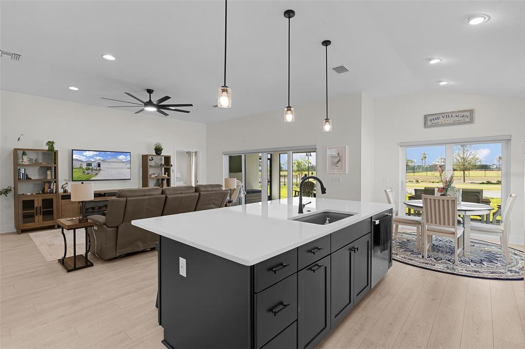 6776 Robinette Run, Unit ROBINETTE RUN The Villages, FL 34762 - Photo 13 of 52 a kitchen with a counter space cabinets and appliances