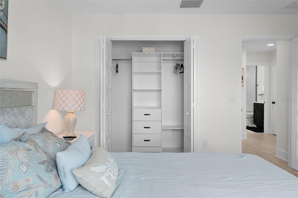6776 Robinette Run, Unit ROBINETTE RUN The Villages, FL 34762 - Photo 23 of 52 a bedroom with a white bed and a dresser