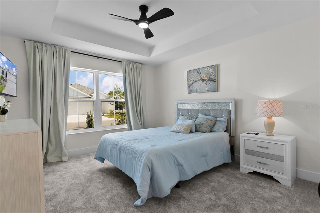 6776 Robinette Run, Unit ROBINETTE RUN The Villages, FL 34762 - Photo 24 of 52 a bedroom with a bed and a window