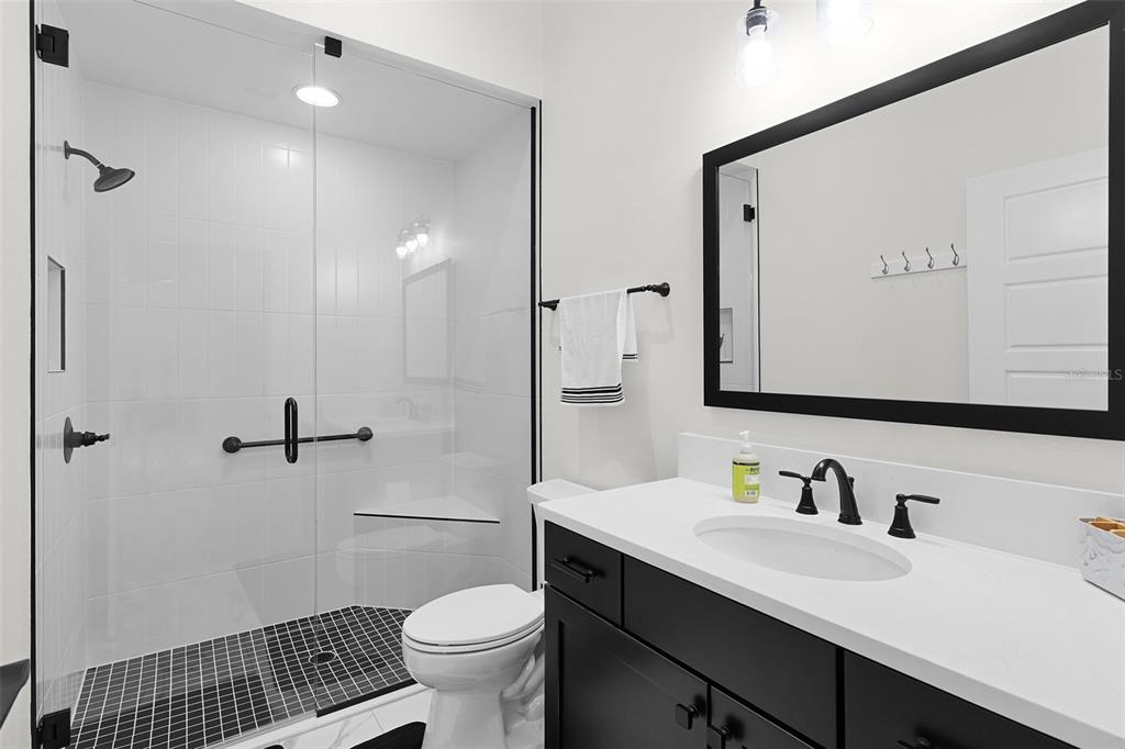 6776 Robinette Run, Unit ROBINETTE RUN The Villages, FL 34762 - Photo 26 of 52 a bathroom with a sink and a mirror