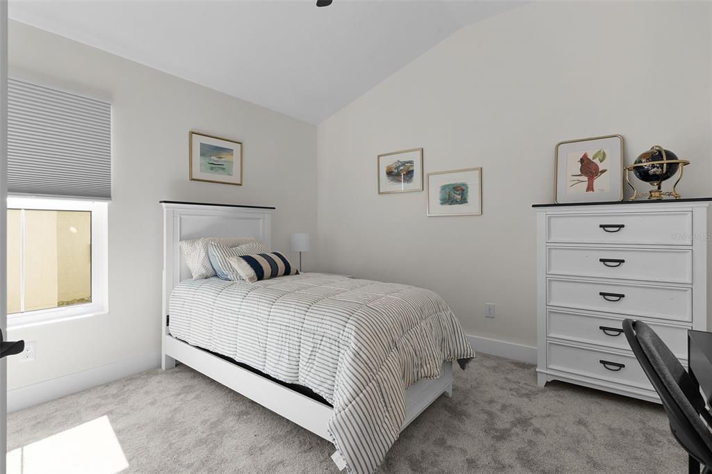 6776 Robinette Run, Unit ROBINETTE RUN The Villages, FL 34762 - Photo 27 of 52 a bedroom with a bed and a window