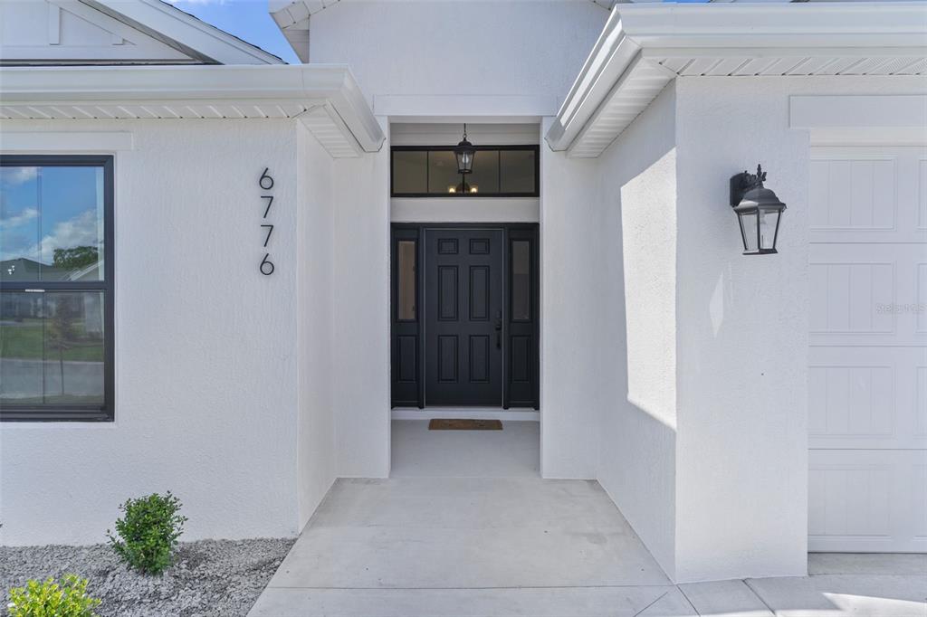 6776 Robinette Run, Unit ROBINETTE RUN The Villages, FL 34762 - Photo 3 of 52 a view of an entryway of house