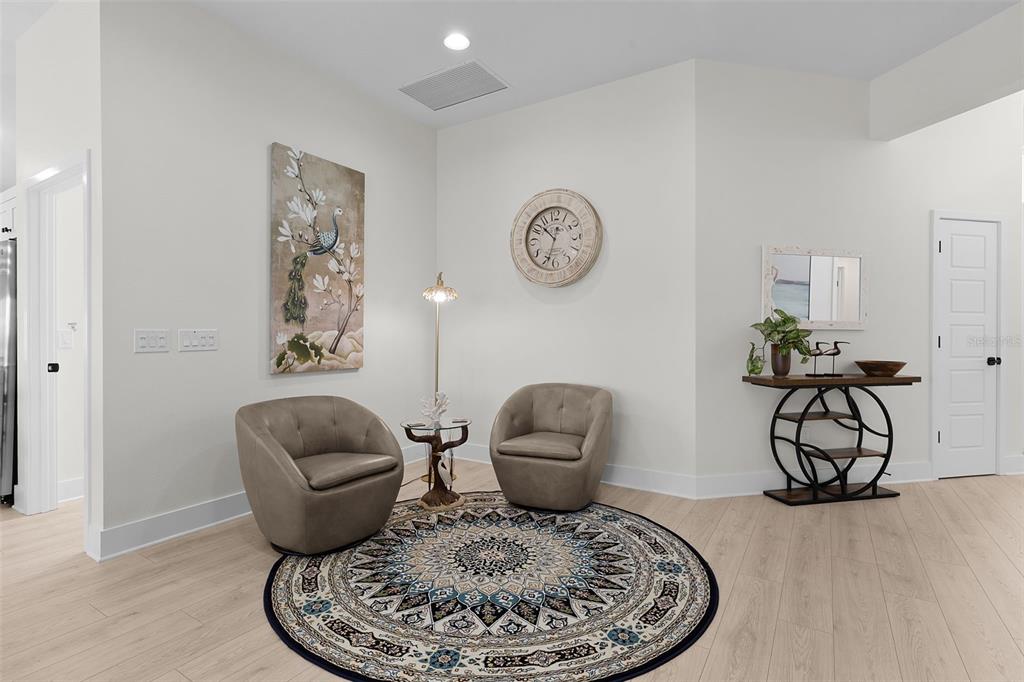 6776 Robinette Run, Unit ROBINETTE RUN The Villages, FL 34762 - Photo 31 of 52 a living room with furniture and a table