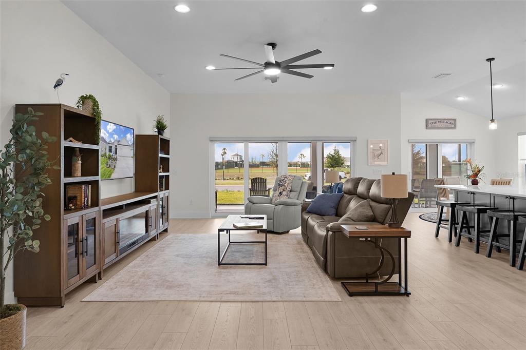 6776 Robinette Run, Unit ROBINETTE RUN The Villages, FL 34762 - Photo 33 of 52 a living room with furniture and a flat screen tv