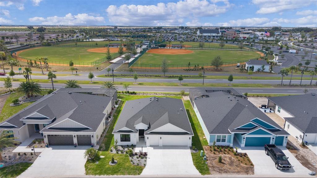 6776 Robinette Run, Unit ROBINETTE RUN The Villages, FL 34762 - Photo 50 of 52 an aerial view of a house with a lake view
