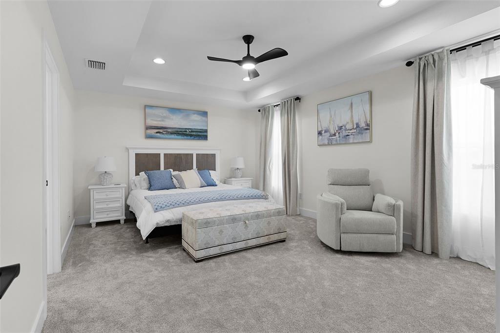 6776 Robinette Run, Unit ROBINETTE RUN The Villages, FL 34762 - Photo 8 of 52 a living room with furniture and a ceiling fan