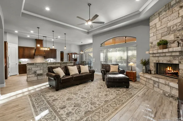 a living room with furniture and a fireplace