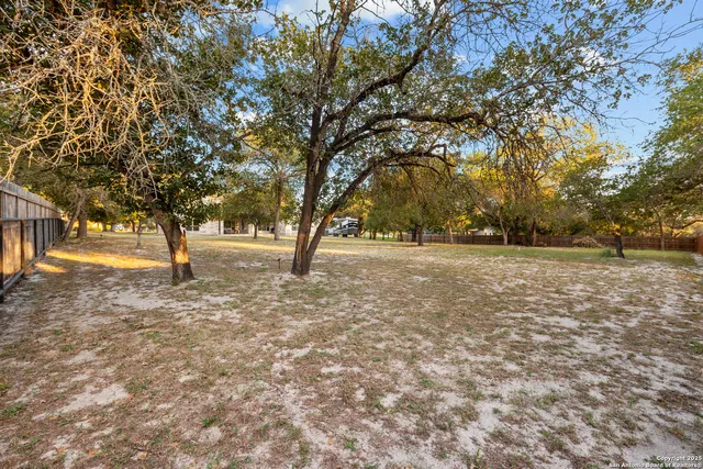 a view of outdoor space with deck and trees