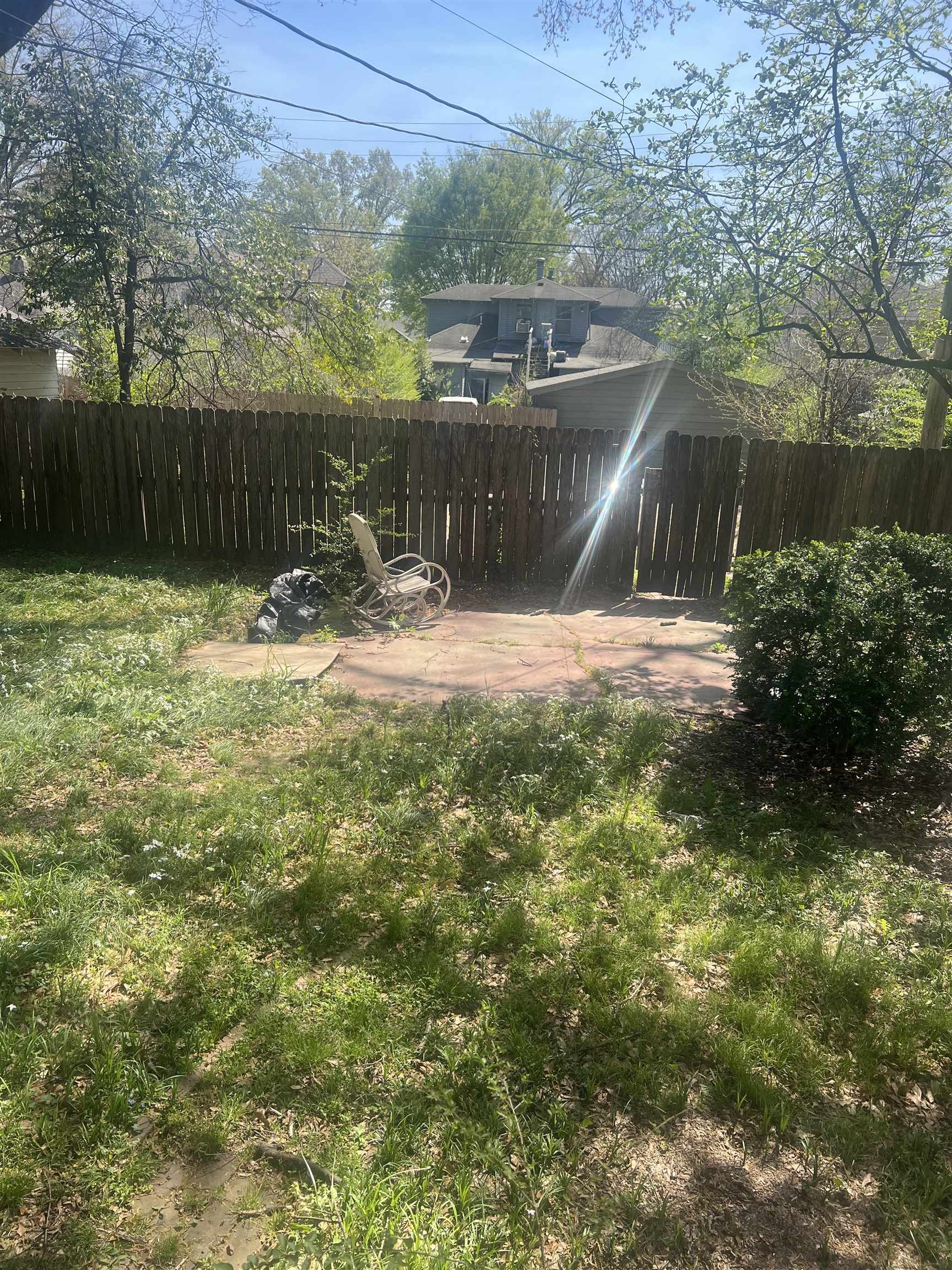 1353 Harbert Avenue Memphis, TN 38104 - Photo 17 of 18 a backyard of a house with lots of green space