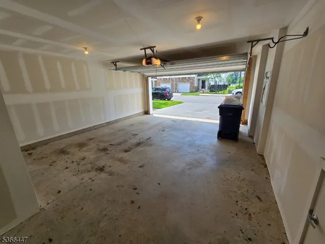 a view of hallway with stairs and furniture