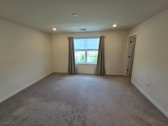 wooden floor and window in an empty room