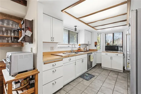 a kitchen with a cabinets and appliances