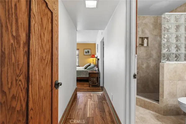 a view of a bathroom from a hallway