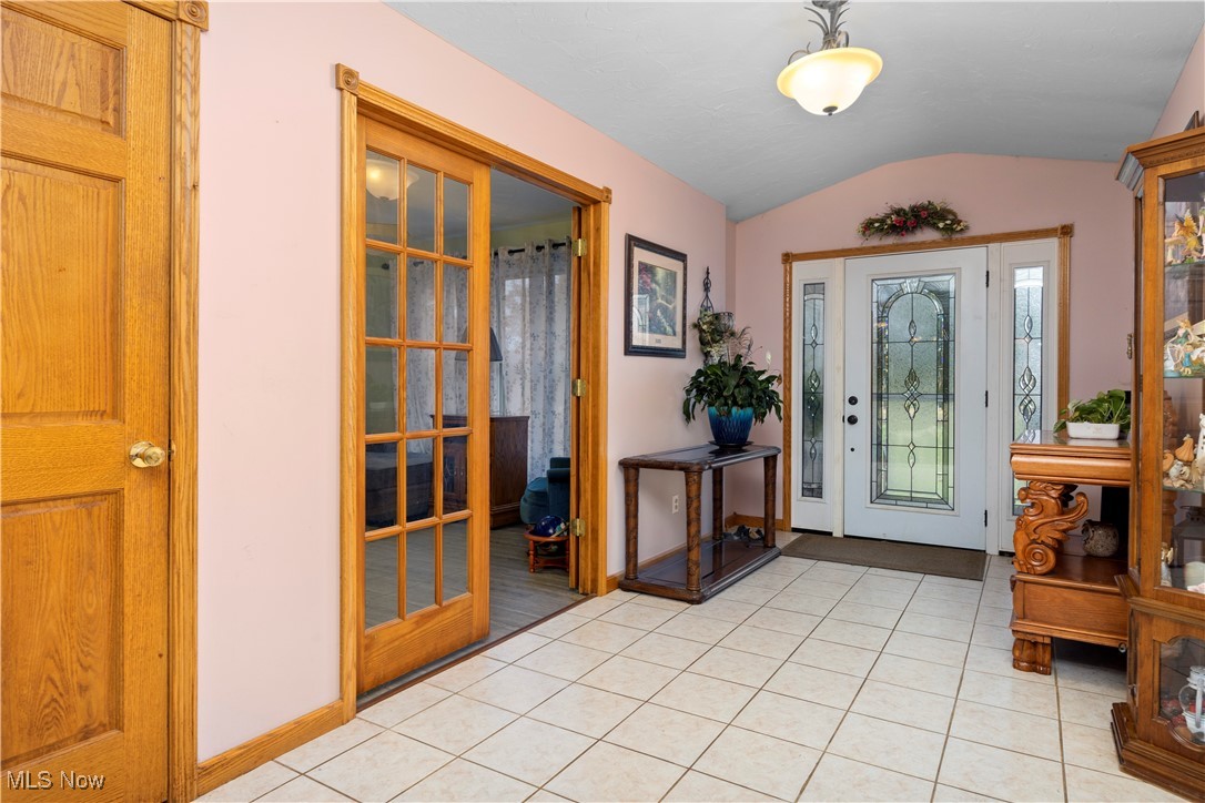 14951 Rickel Road West Salem, OH 44287 - Photo 3 of 46 Entrance foyer with vaulted ceiling and light tile patterned floors