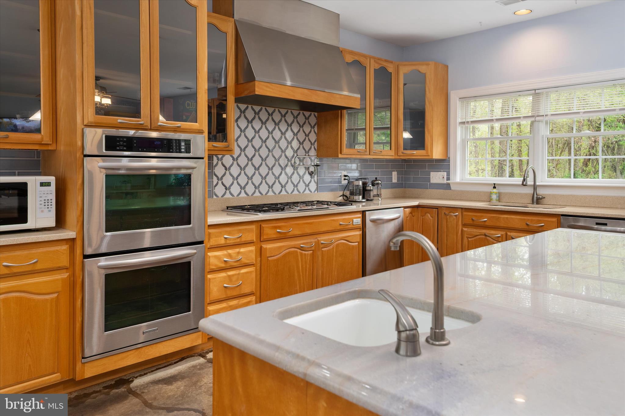 730 Central Avenue East Edgewater, MD 21037 - Photo 13 of 63 a kitchen with a sink and a stove top oven