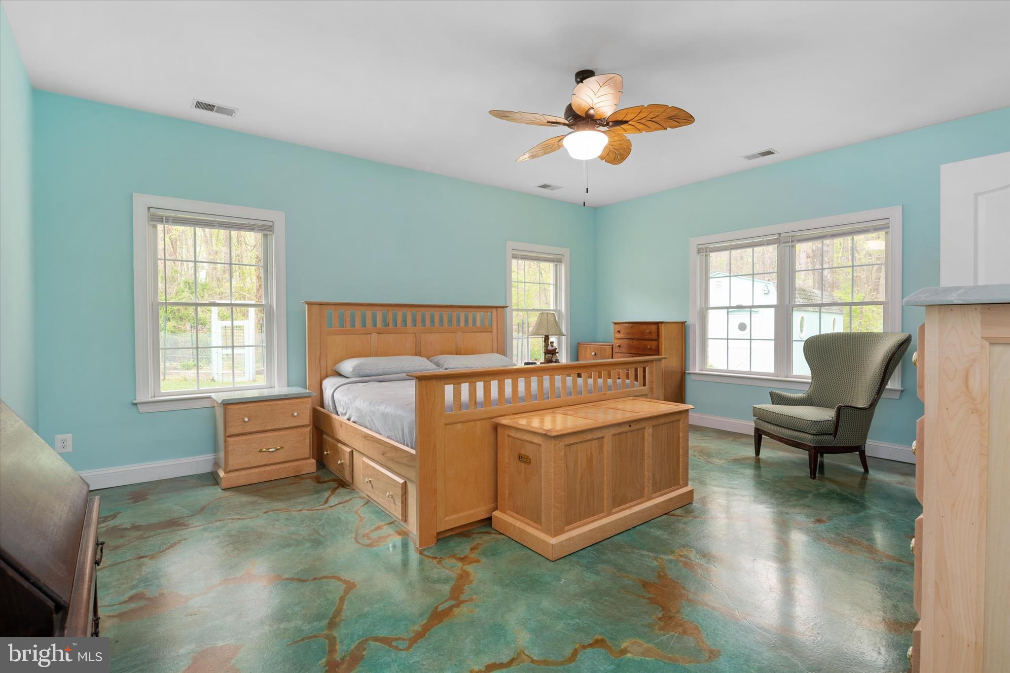 730 Central Avenue East Edgewater, MD 21037 - Photo 20 of 63 a bedroom with a bed and a chandelier