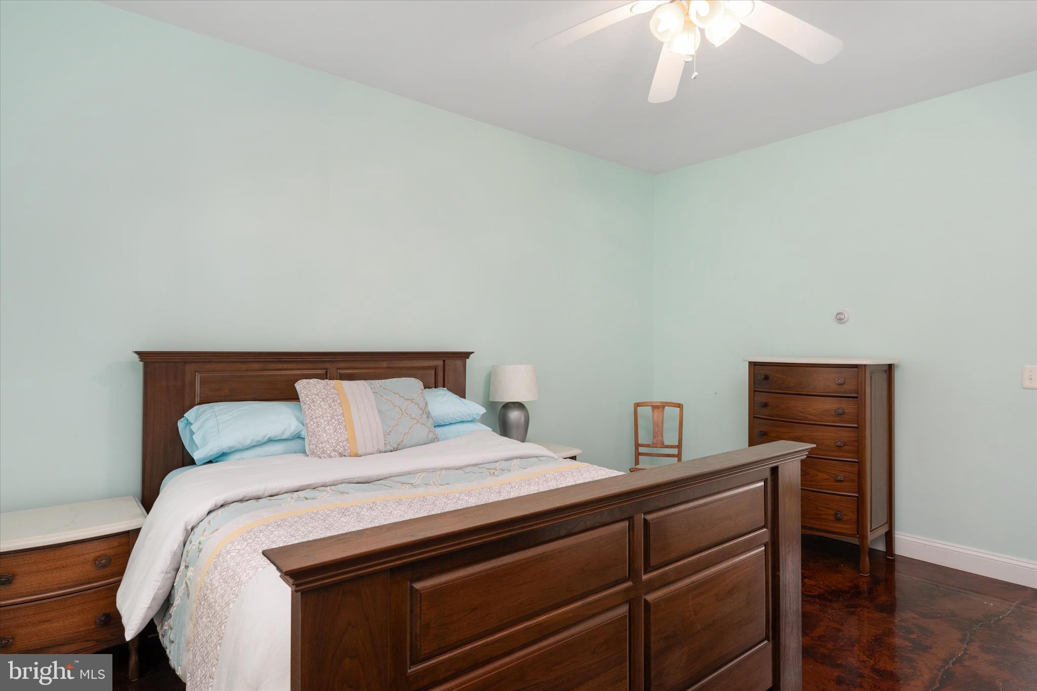730 Central Avenue East Edgewater, MD 21037 - Photo 26 of 63 a bedroom with a bed and a chandelier