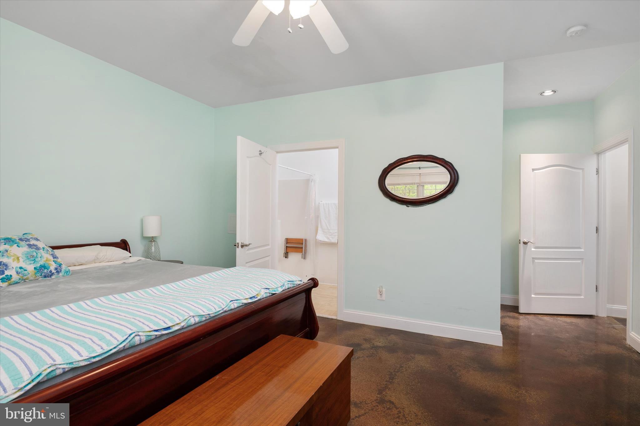 730 Central Avenue East Edgewater, MD 21037 - Photo 31 of 63 a bedroom with a bed and a chandelier