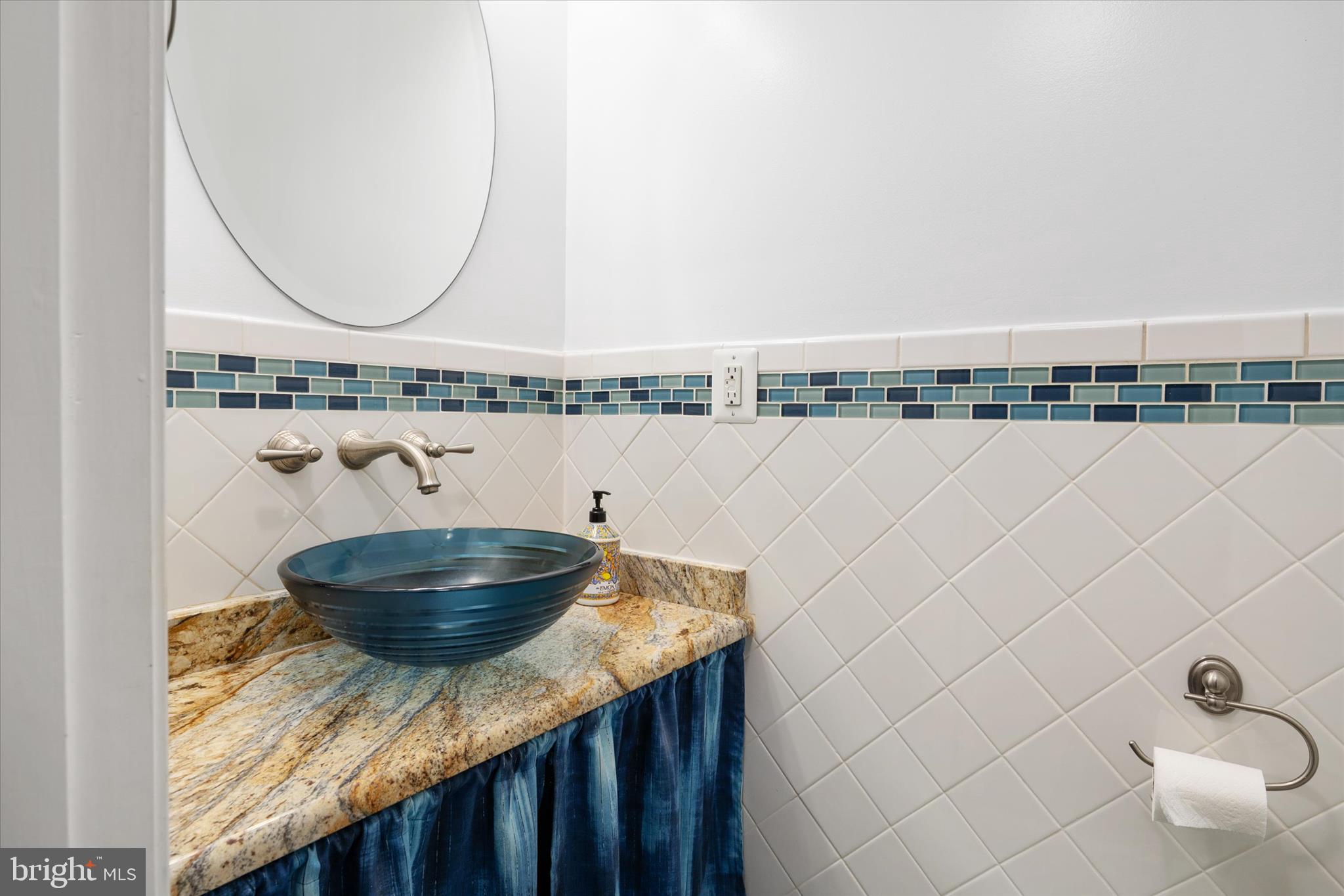 730 Central Avenue East Edgewater, MD 21037 - Photo 34 of 63 a bathroom with a granite countertop bathtub a sink and a wooden floor