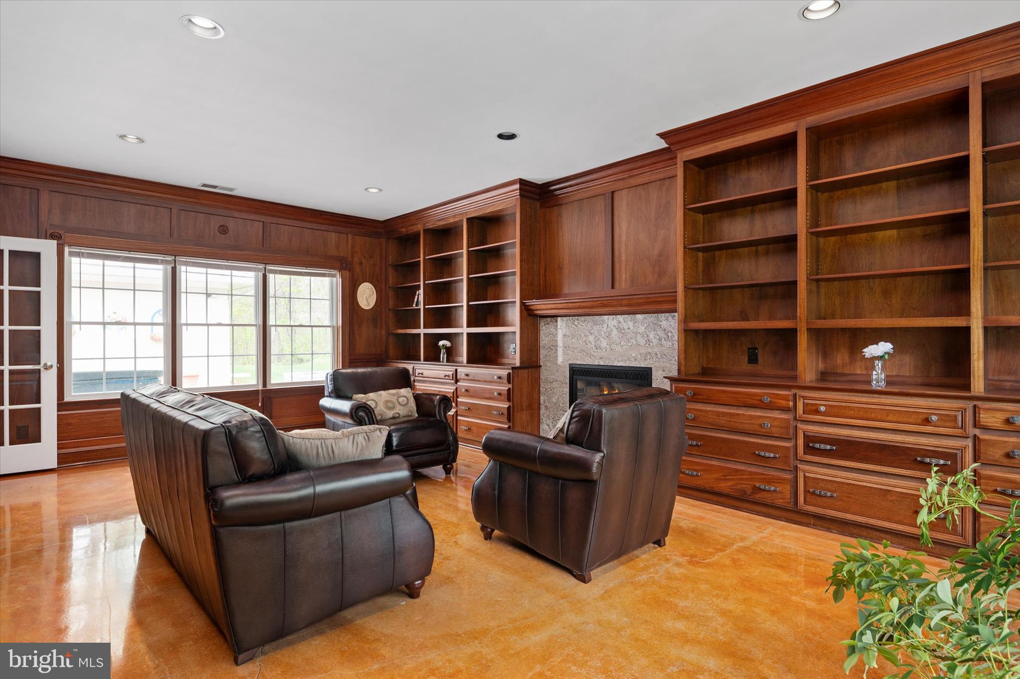 730 Central Avenue East Edgewater, MD 21037 - Photo 9 of 63 a living room with furniture windows and a fireplace