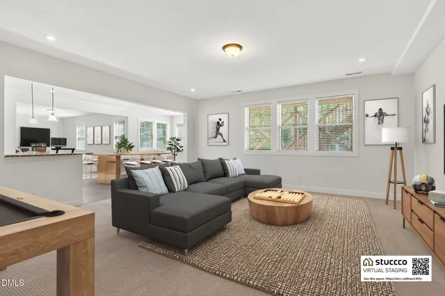 a view of a kitchen with wooden floor and windows