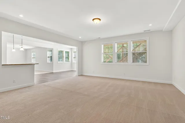 a view of kitchen with wooden floor and electronic appliances