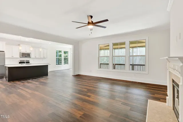 a view of a wooden house with a yard