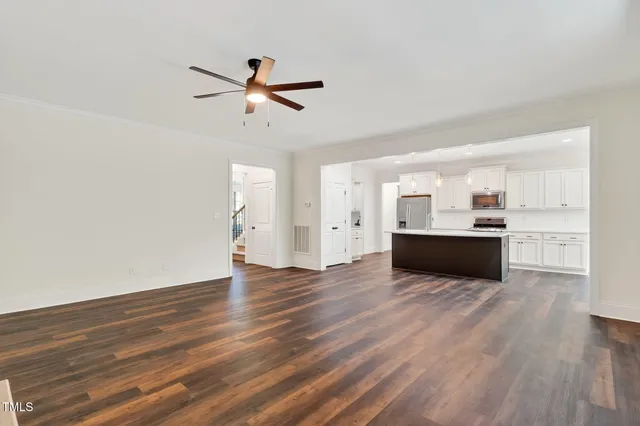 an aerial view of a house with a yard basket ball court and outdoor seating