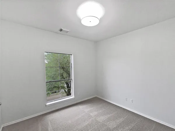 a view of a room that has a window in it