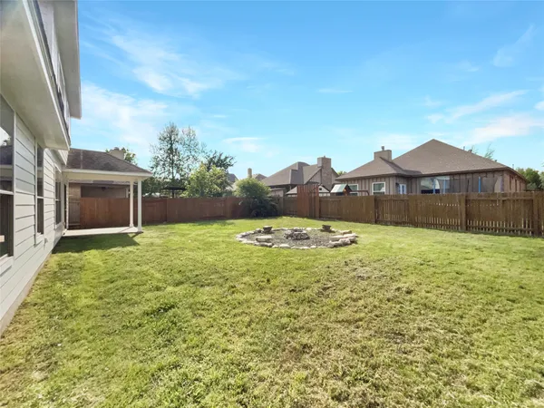 a view of a backyard with a garden and plants