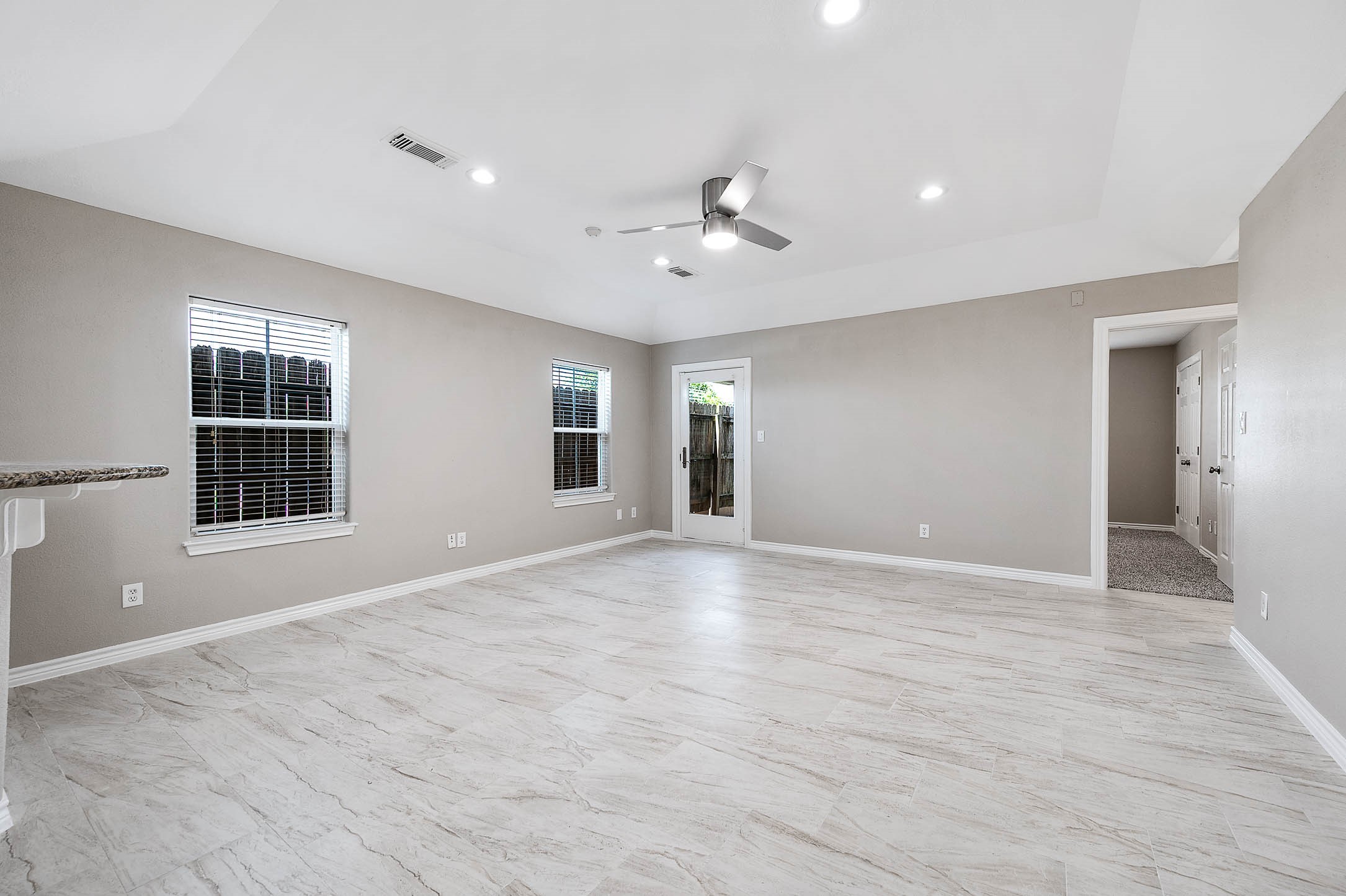 7308 Avenue R Galveston, TX 77551 - Photo 12 of 24 a view of an empty room with a window