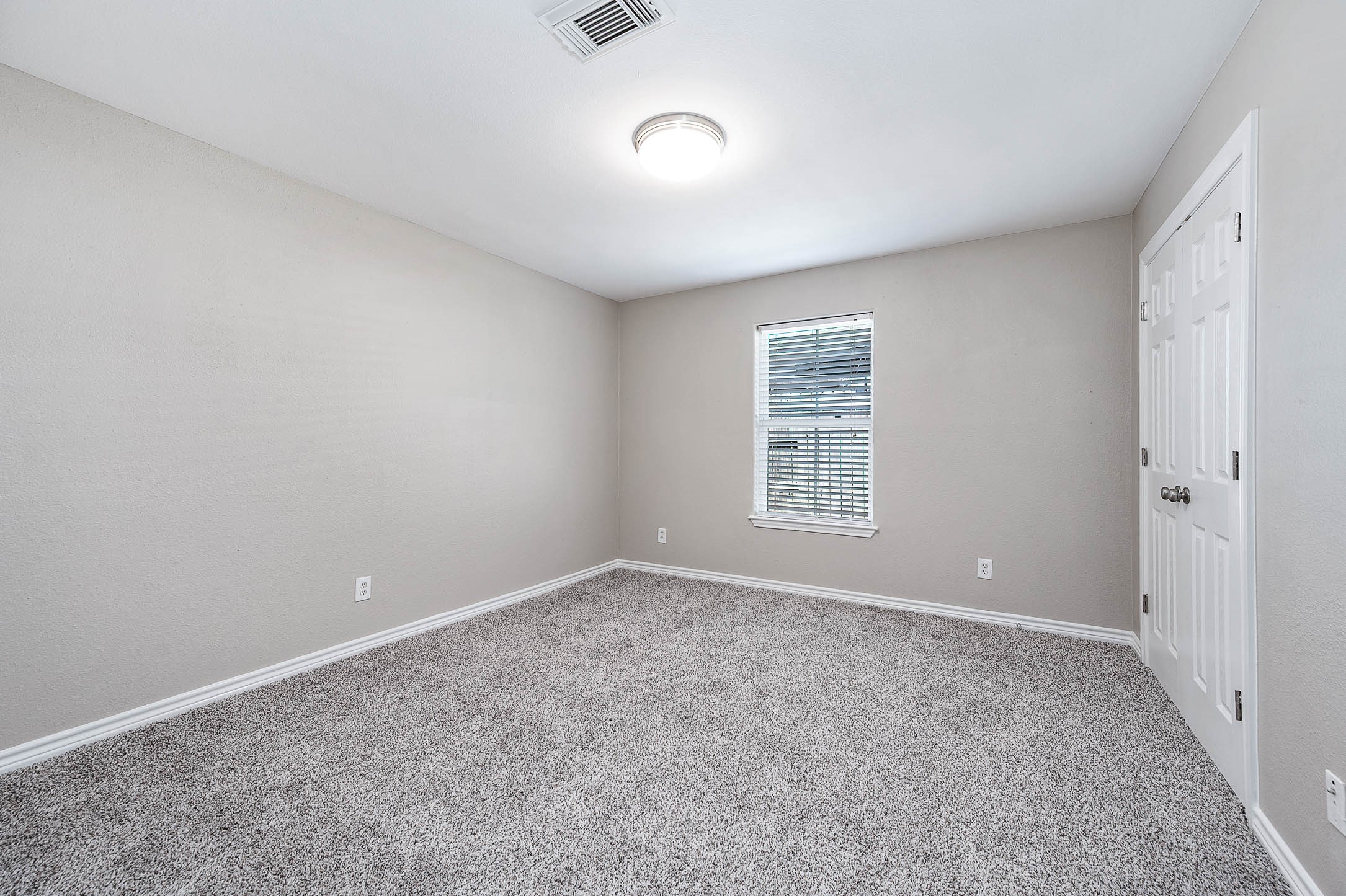 7308 Avenue R Galveston, TX 77551 - Photo 15 of 24 a view of an empty room with a window