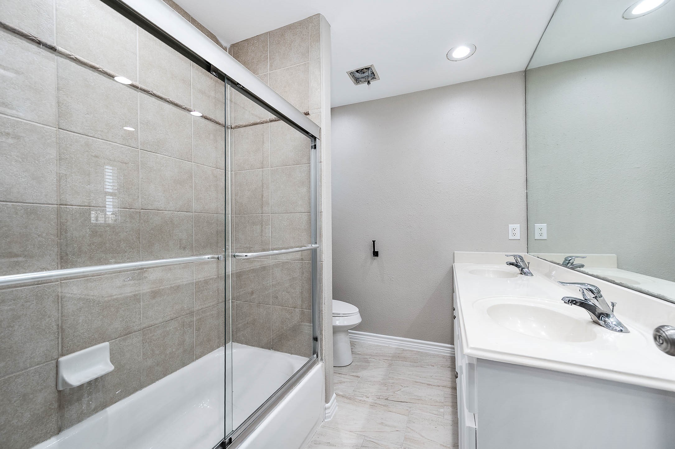 7308 Avenue R Galveston, TX 77551 - Photo 20 of 24 a bathroom with a sink and a mirror
