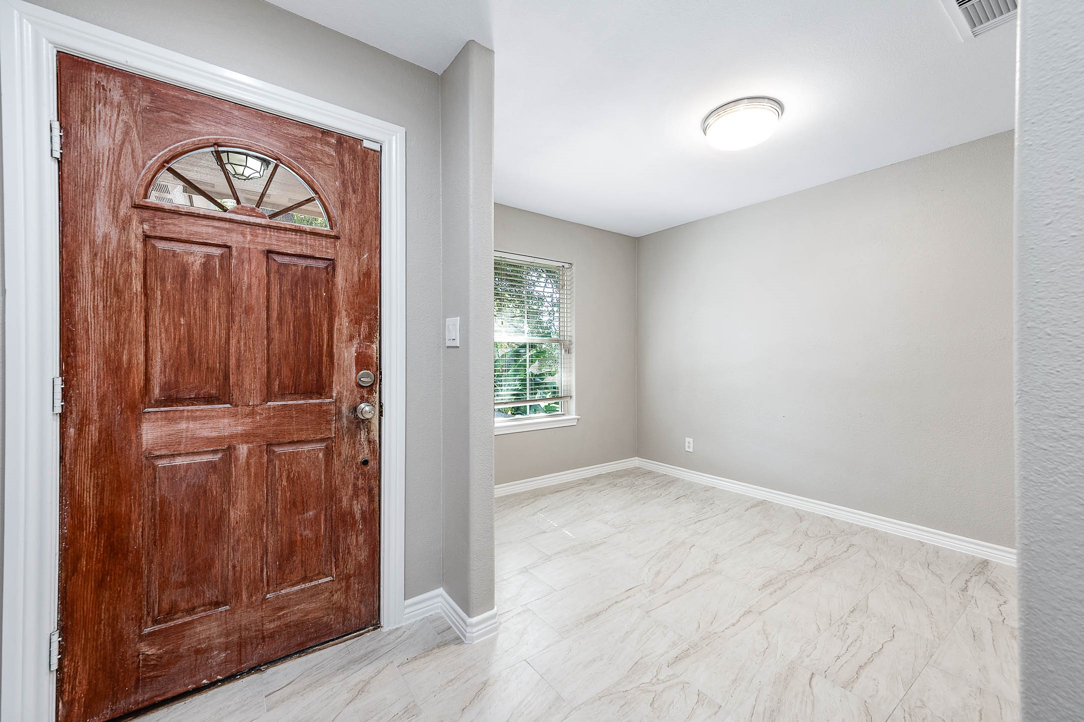 7308 Avenue R Galveston, TX 77551 - Photo 6 of 24 an empty room with wooden floor closet and windows