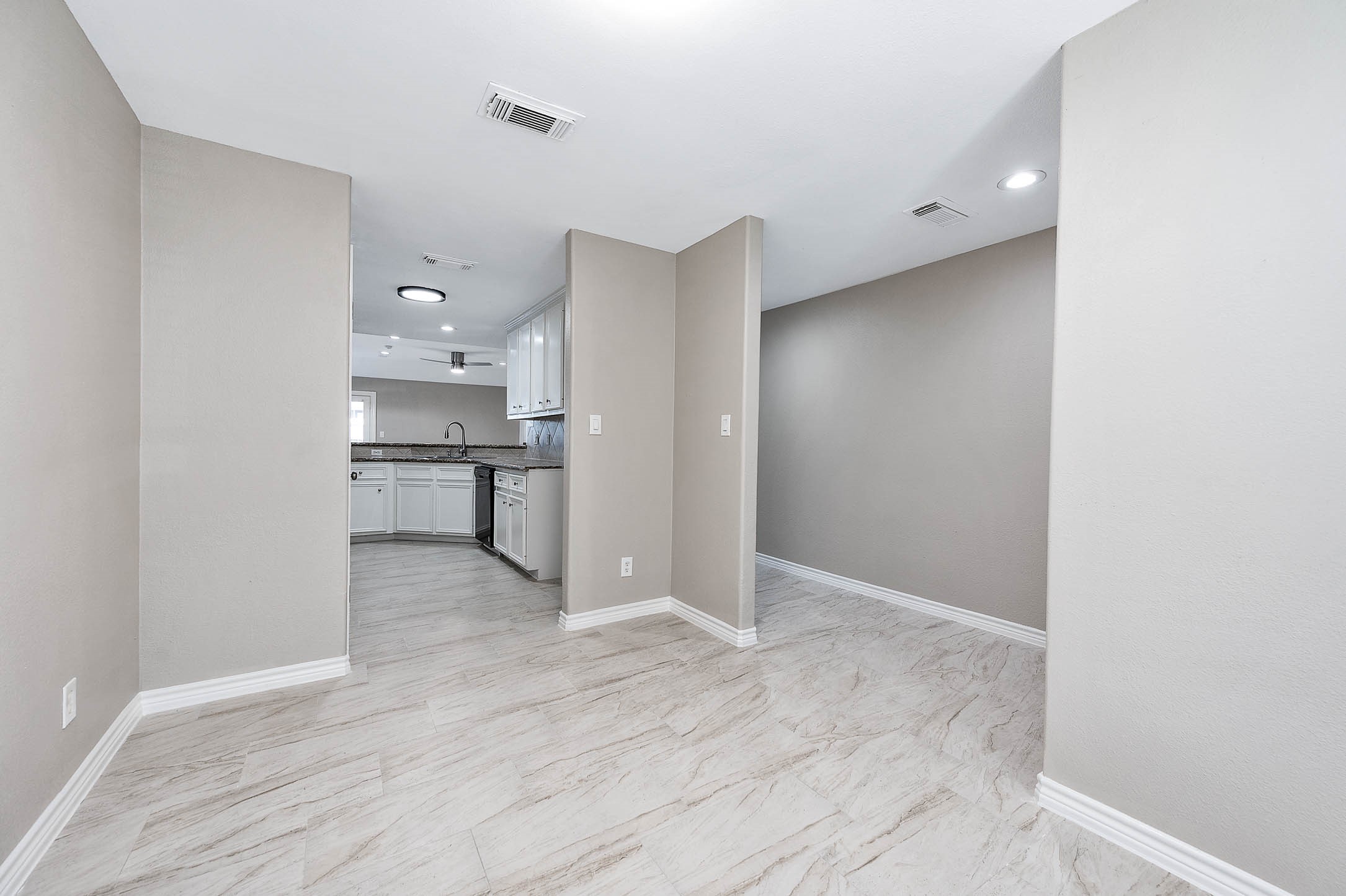7308 Avenue R Galveston, TX 77551 - Photo 7 of 24 a view of a kitchen with wooden floor and a sink