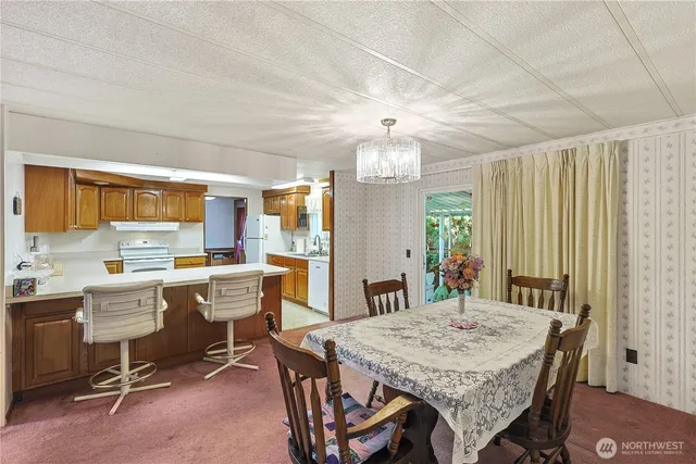 a view of a dining room with furniture window and outside view
