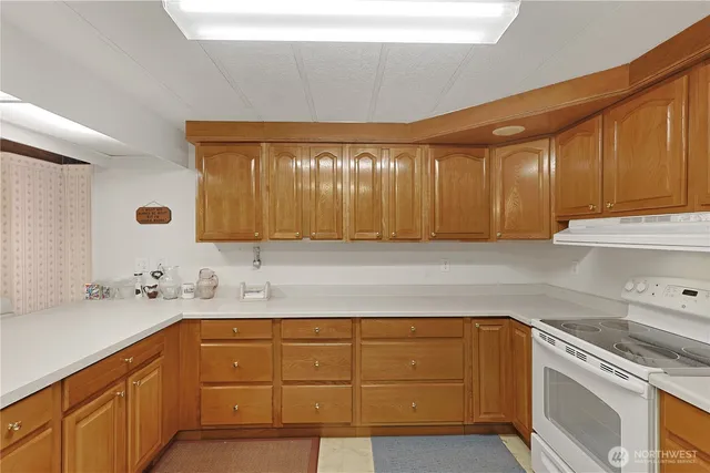 a spacious bathroom with double vanity sink a mirror and a shower