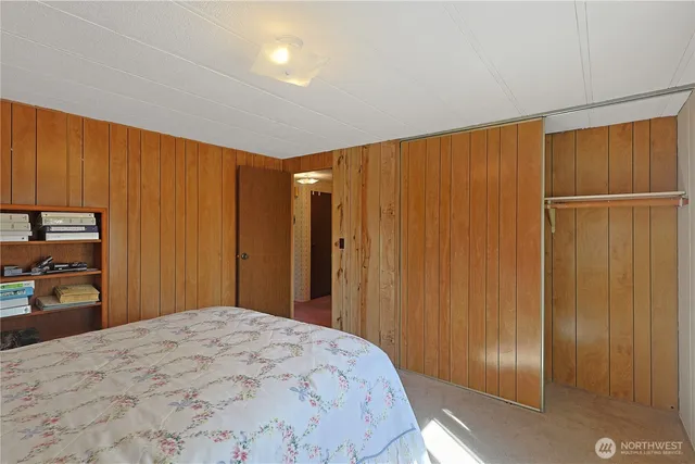 a bedroom with a bed and a closet