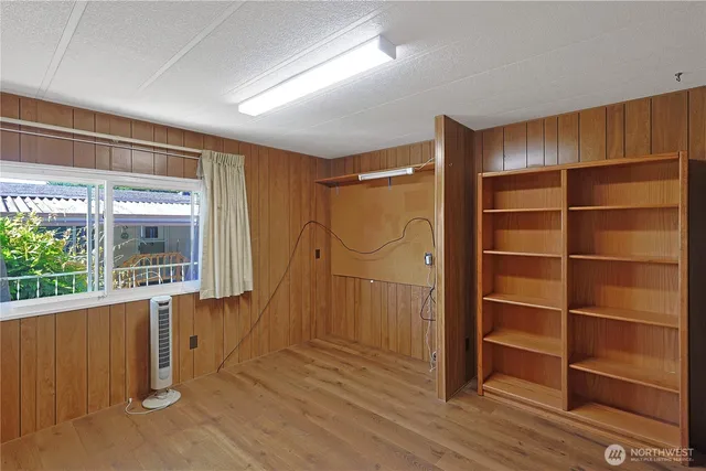 a view of an empty room with a window