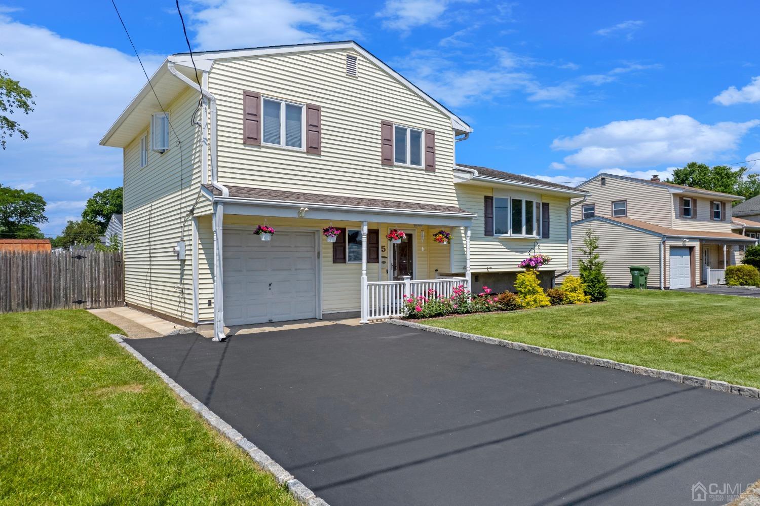 15 Brian Road Edison, NJ 08817 - Photo 3 of 19 a front view of a house with garden