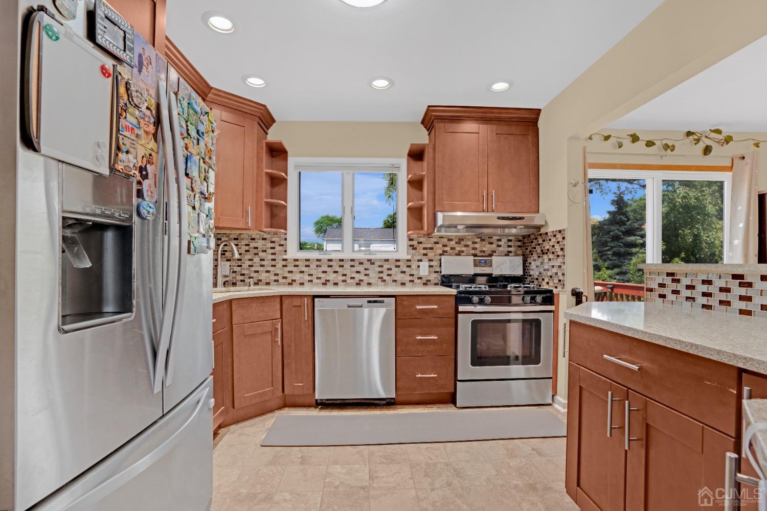 15 Brian Road Edison, NJ 08817 - Photo 7 of 19 a kitchen with stainless steel appliances granite countertop a stove and a refrigerator